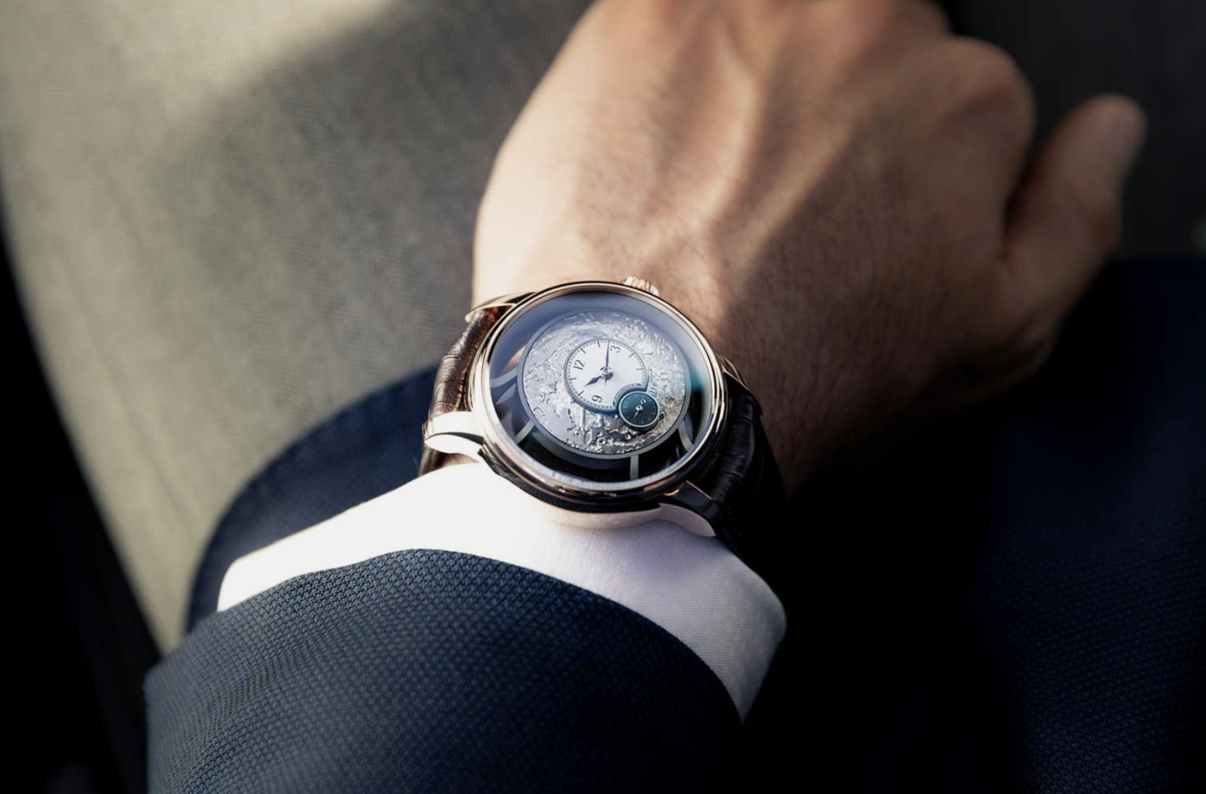 A man wearing a watch and a suit - AS&S.png